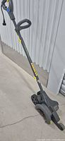 Full view of Yardworks corded electric walk-behind mower showing handle, wheels, and body