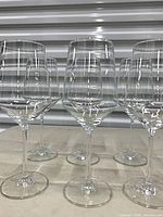 Front view of six Zwiesel red wine glasses standing together