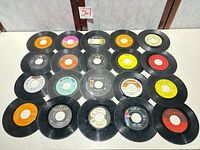 All 20 singles laid out showing label variety