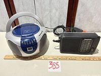 Emerson boombox, Panasonic radio, power cord shown