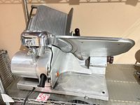 Left front view showing blade, carriage, clamp, power cord