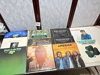 Overview of 10 album jackets laid out on table