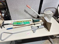 All four gardening tools displayed on tabletop