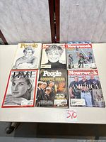 All six magazines laid out on table