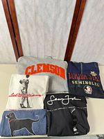 Folded view of six tops showing graphics and colors