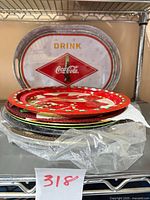 Stack of nine trays and chargers showing top and bottom items