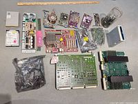 All items laid out: various boards, drives, jar, bagged boards