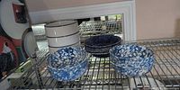Stacks of three bowl patterns on wire shelf