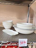 Group view: four basket-weave bowls stacked, two nested serving bowls, oblong tray