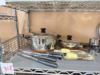 Cookware and utensils on shelving