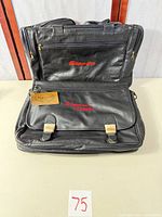 Front and back view of Snap-on black faux leather bag showing logo and compartments