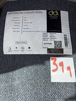 Label showing brand, collection, materials, size and QR code