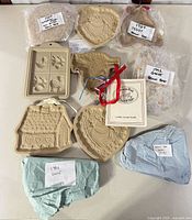 Overview of all ten molds, ribbons and recipe booklet