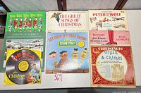 Overview of all eight records laid out on table