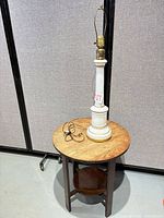 Full view of lamp on round side table showing overall appearance