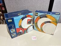 Two original boxes: 16-piece dinnerware set and sealed serving set