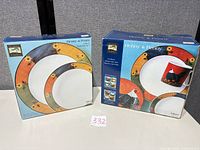 Front of boxed 16-piece set and boxed 2-piece serving set