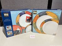 Front view of two sealed boxes for dinner set and serving set