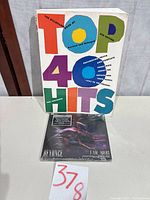 Front view of book and sealed DVD/CD set