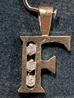 Front view showing letter F shape and diamonds
