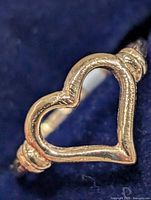 Front view of 10K gold ring showing open heart design