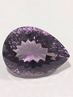 Pear-cut purple amethyst showing crown and table facets