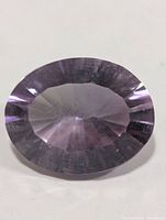 Front view of oval faceted amethyst showing table and crown facets