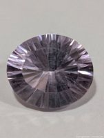 Top view of round faceted light purple amethyst