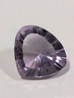 Top view of faceted light purple amethyst gemstone