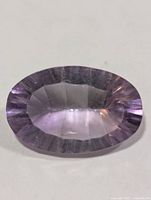 Top view of oval faceted amethyst showing table and crown facets
