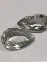 Two pear-cut green amethyst stones, top view