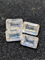 Four rectangular moonstones on black background