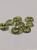 Close-up of oval peridot gemstones