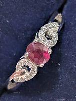 Top view of ring showing ruby and accent stones