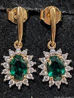 Front view of both earrings showing chrome diopside centers and CZ halos