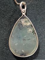 Front view of teardrop prehnite pendant in silver bezel