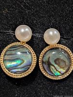 front view showing abalone shell cabochons and pearls