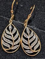 Front view of both leaf-shaped diamond earrings