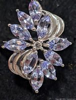Top view of silver ring showing tanzanite floral cluster