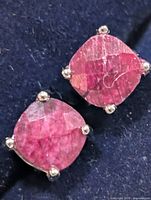 front view of both square dyed ruby studs set in silver