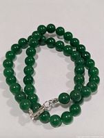 Full view of jade bead necklace showing clasp and bead size