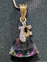 front view of pendant showing mystic topaz, ribbon accent and bail