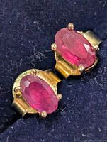 Front view of both ruby stud earrings