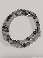 Full view of 16" rutilated quartz bead necklace coiled