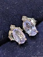 Front view of both silver tanzanite stud earrings in case