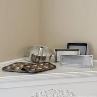 Assorted baking pans on shelf