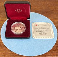Open presentation case showing encapsulated coin and specification card