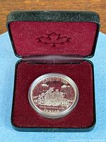 Reverse of 1989 Mackenzie River silver dollar in RCM case