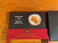 Coin in capsule within Royal Canadian Mint case