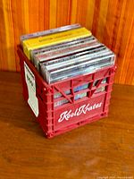 Crate front view showing Kool Krates logo and row of CDs